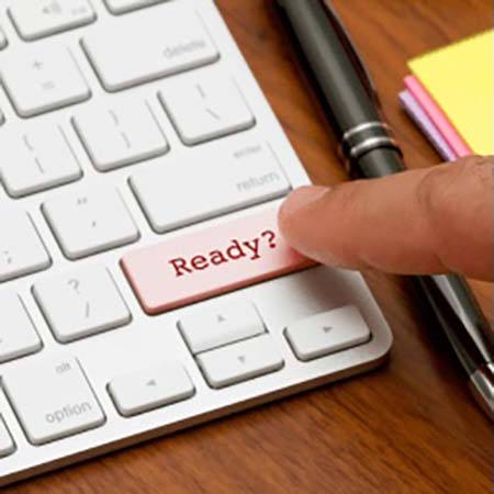 person about to push a button on keyboard that says 'ready'