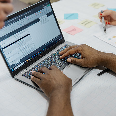 Person typing on a laptop