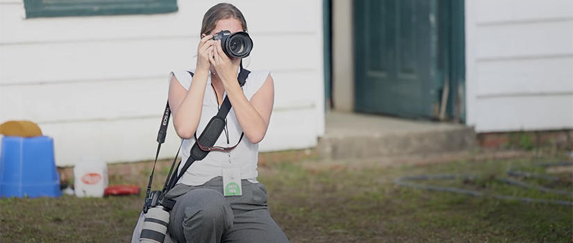 student being interviewed; horse in background