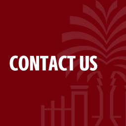 Professor Black teaching from behind a podium.