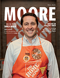 Magazine cover featuring: alum wearing a Home Depot apron.