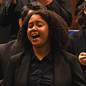 a female choral singer singing