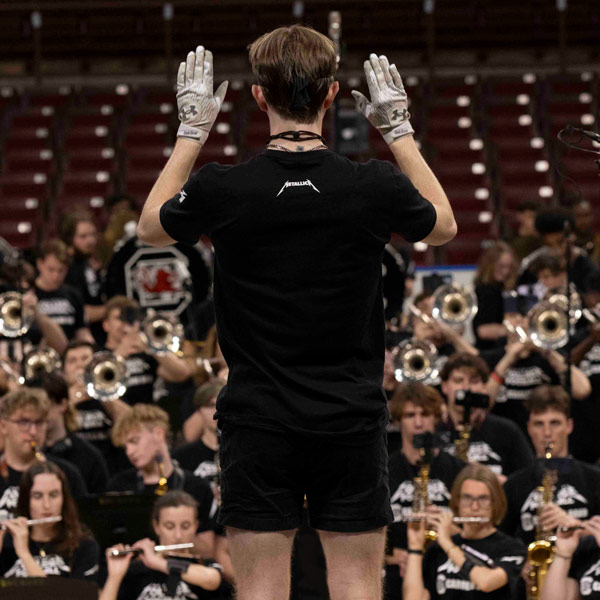 The drum major leads the Carolina bnad as it records the Metallica song for EA Sports.