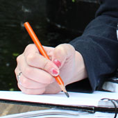 hand holding pencil writing