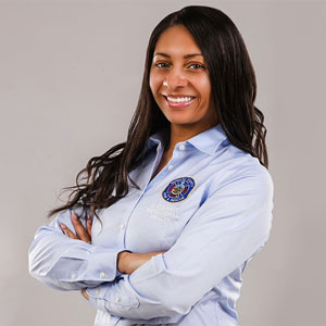 Cowart-Drayton crosses her arms in a work headshot